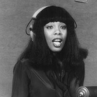 Publicity photo of singer Donna Summer in the recording studio in 1977.
